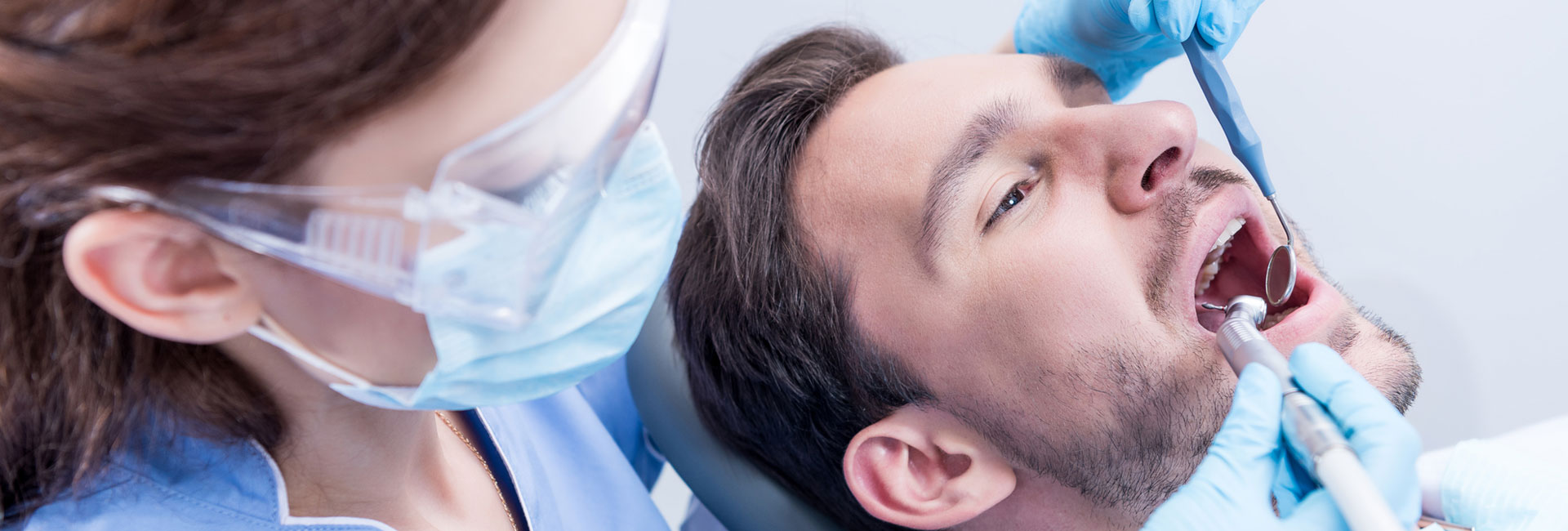 Dentist curing patients teeth