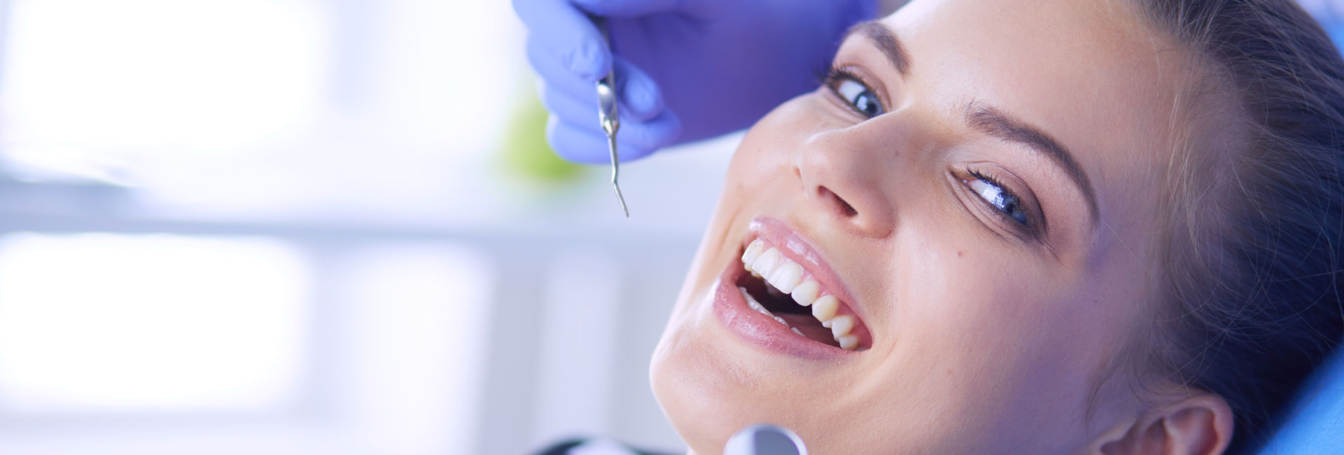 Dentist examining patient teeth